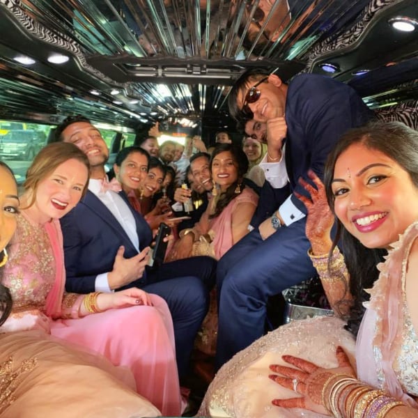 Wedding party inside Hummer with Deck
