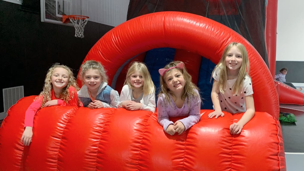Girls on inflatable slide