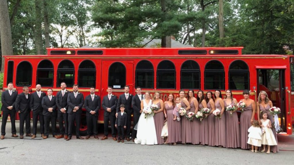 Team Johnson Trolley exterior with wedding party
